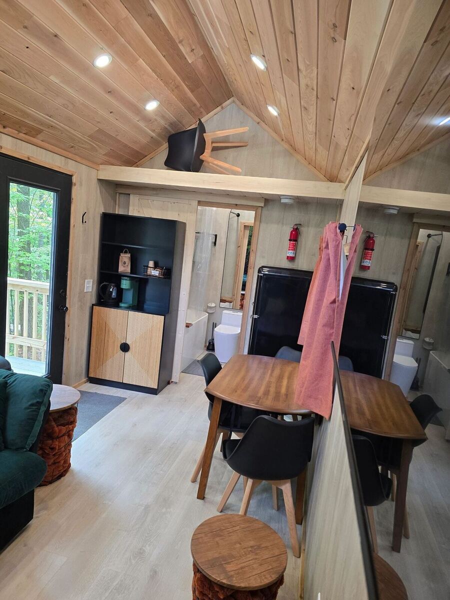 Entrance to Cabin 36, a mountain cabin rental at Sasquatch Farm RV Park