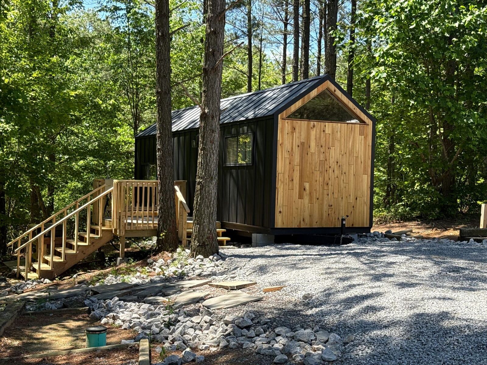 Exterior view of Cabin @28 nestled in the trees