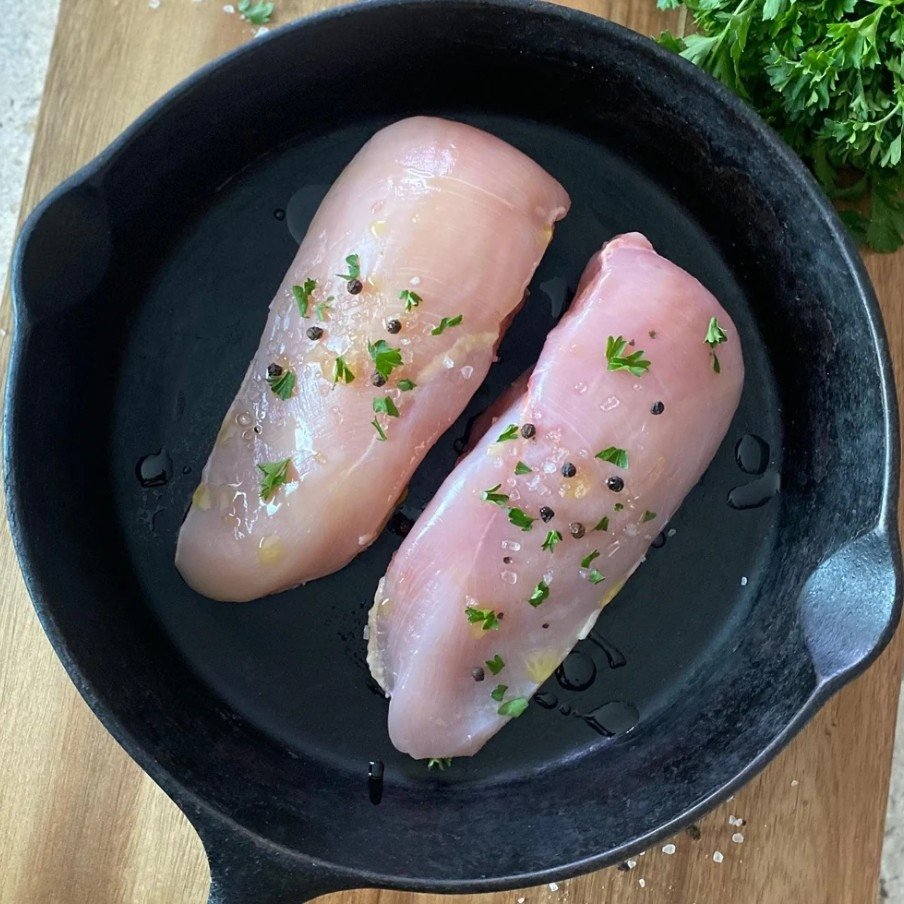 Tennessee Grass Fed chicken breast in a cast iron skillet