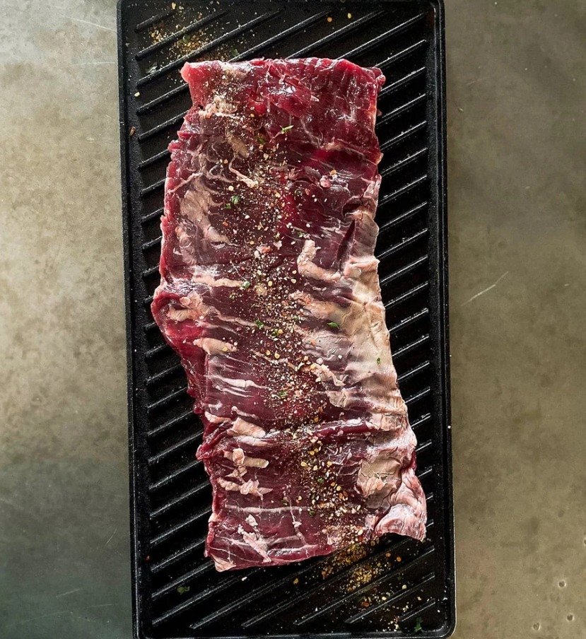 Tennessee Grass Fed skirt steak seasoned on a grill pan